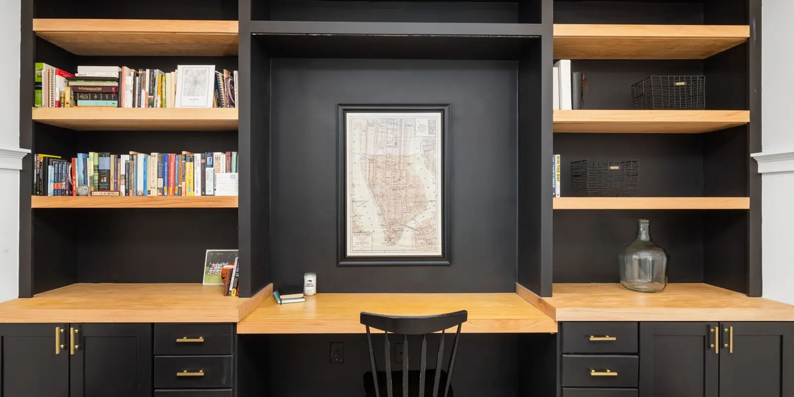 Built-in shelves and a desk along one wall