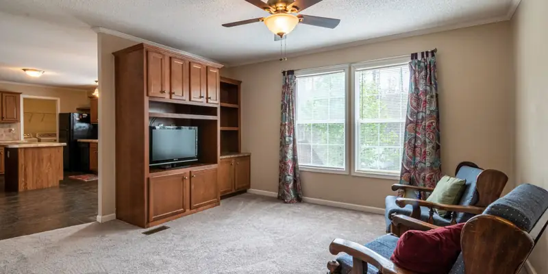 A living room with a ceiling fan