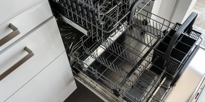 An open dishwasher with its racks pulled out