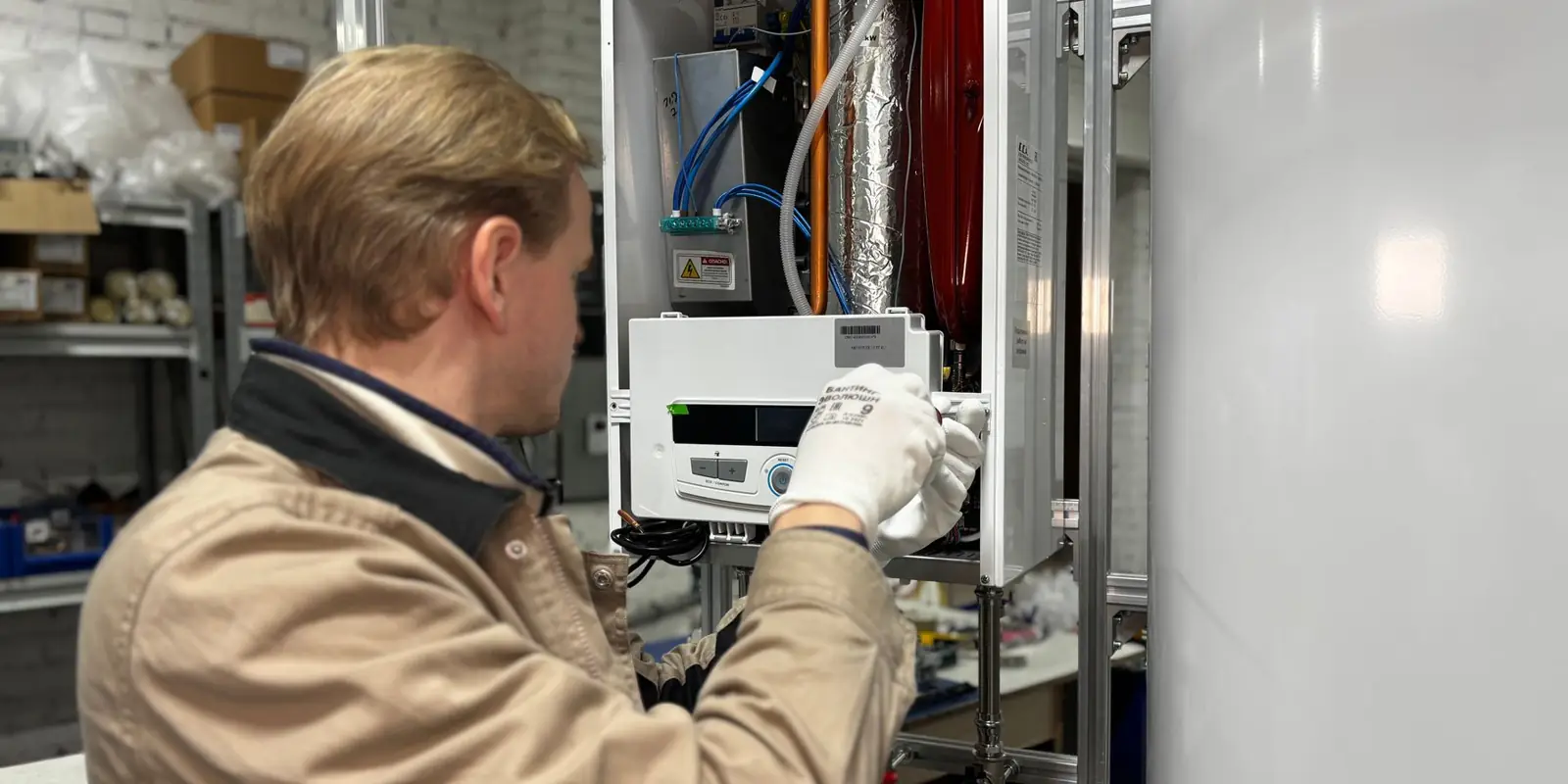 A technician working on a water heater